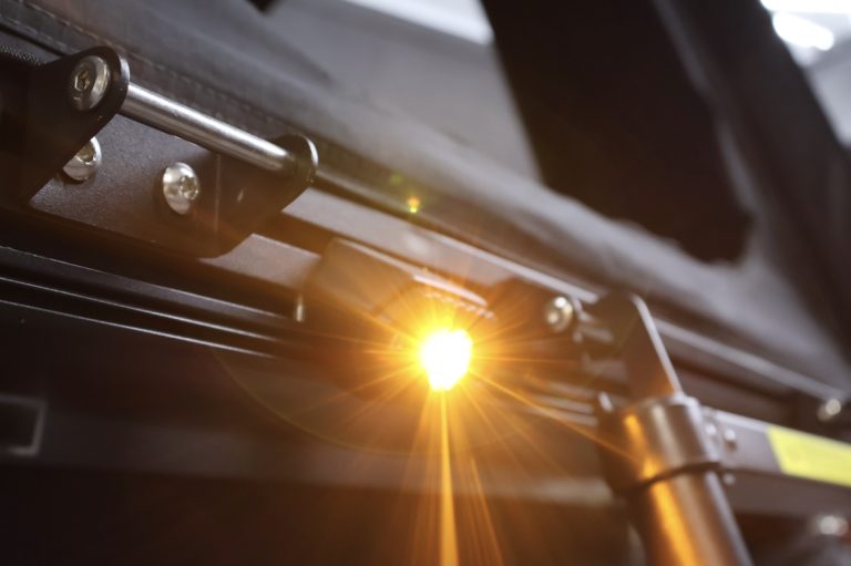 White and amber LED Aurora lights illuminating ladder for easy nighttime access